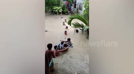 Baby rescued in basin during typhoon floods in the Philippines