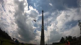 Time lapse captures helicopter lifting a new antenna on to Yorkshire's tallest structure