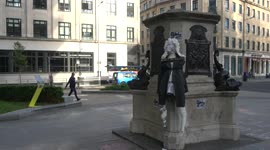 Effigy of Edward Colston strapped to the empty plinth and hit with a cricket bat in Bristol on 1st anniversary