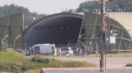G7 security teams in the Cornwall airport ring of steel security zone. Specialist teams make use of a huge cold war hardened hangar in the Trebelsue area of this ex military airfield