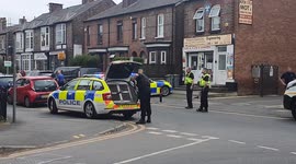 GMP Police dog handler getting his police dog from van to search for suspect