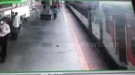 Railway security personnel saves passenger from falling under moving train in western India
