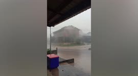 Home roof ripped off during storm in northeastern Thailand