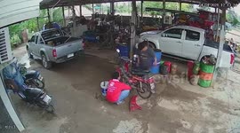 Mechanic shows his quick reactions by putting out motorcycle fire