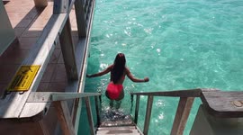 Walking through a water villa in the Maldives 1
