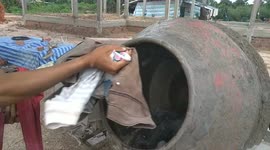 Man uses cement mixer to wash clothes