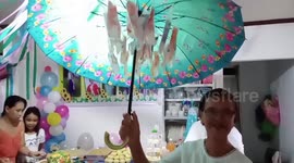 Gift hack! Surprise your special someone with cash pinned to an umbrella