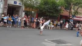Excited boy somersaults out of exam centre after finishing university test in China