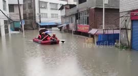 Chinese firefighters rescue people trapped in flooded buildings due to heavy rainstorm