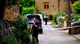Woman arrested on suspicion of murder after man's body is found in a burnt out garden shed in picturesque village