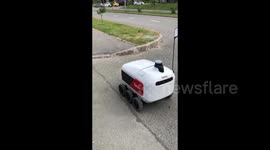 A robot courier delivers food to residents of Innopolis, Russia