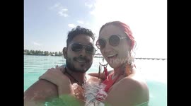 Tourist walking onto a beach in the maldives 7