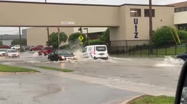 Cars slosh through flooded roads in Pennsylvania