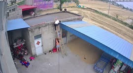Chinese mother catches 2-year-old son after he followed father up ladder