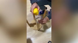 Chinese man uses overcooked steamed bun to hammer nail into wooden stool