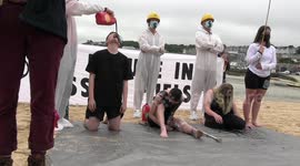 Black liquid poured into Extinction Rebellion protesters' mouths during G-7 summit demonstration