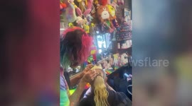 Further footage: Meet the hair artist who dyes his clients' hair with colourful EMOJIS