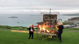 Boris and the oil head Burning The Future- Viking ship burning sail with ‘As the sea dies We die’