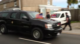 US President Joe Biden's motorcade passes Extinction Rebellion banners at G7 Summit