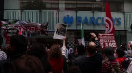 Free Palestine activist's protesting outside Barclays bank, in Manchester, England