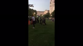 Riot police by London Eye disperse crowd throwing bottles
