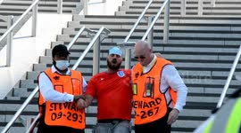 Boozed up England fan is escorted away by police at England Euro 2020 game against Croatia at the Wembley Stadium, UK