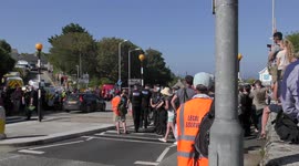 Protestor led away in handcuffs after fastening himself to a storm drain in St Ives, Cornwall