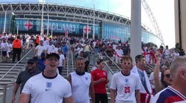 Football fans, including triumphant England supporters, leave Wembley stadium after England’s win against Croatia at UEFA euro 2020 match