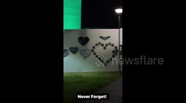UK: Landmarks Of London Light Up In Green In Memory Of Grenfell Fire Victims