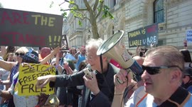 Piers Corbyn dances outside Downing Street at the We Are The Resistance protest in London