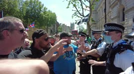 Police and protesters outside Downing Street after woman is pushed to the ground