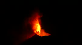Italy's Mount Etna spews spectacular lava flow