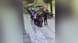 Glass window narrowly misses Chinese employees after falling down from third floor of hotel