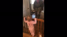 Toddler erupts into laughter as military dad's return home