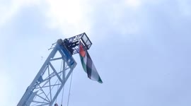 Protester aged 69 climbs crane and hangs Palestine flag from structure in Vauxhall, London