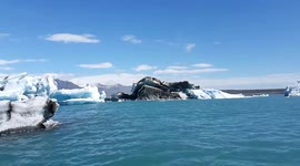 Dramatic moment melting iceberg CAPSIZES revealing rarely-seen black underside