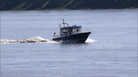 Delivering NHS supplies by high-speed boat up the Thames in London