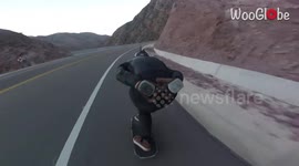 Speeding skateboarders suffer chain-reaction crash as they hurtle down Argentine hill