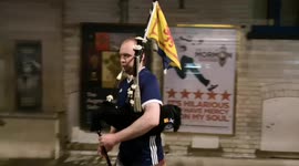 Gone midnight, but piper in kilt plays tune for Scotland fans in Leicester Square