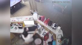Snooker ball flies off table and hits receptionist in the face in central China