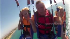 Parasailing family crash into ocean