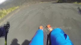 Skiers descend ash-covered Mount Etna