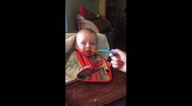 Baby tries raspberries for the first time