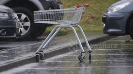 First Day Of Summer In N. Ireland - Abandoned Shopping Trolley In Rain
