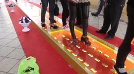 Shoppers walk over gold bullion bars in China