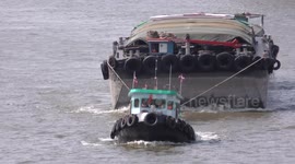Barges on Bangkok's Chao Phraya River