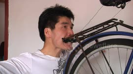 Man lifts heavy weights with his teeth