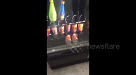 Two drinks get stuck in terrible vending machine
