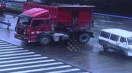 Lorry jackknifes avoiding minibus in China rain