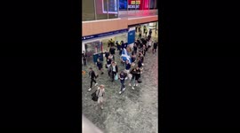 Scotland fans keep arriving in London: Here they are chanting their way through Euston Station on Friday morning